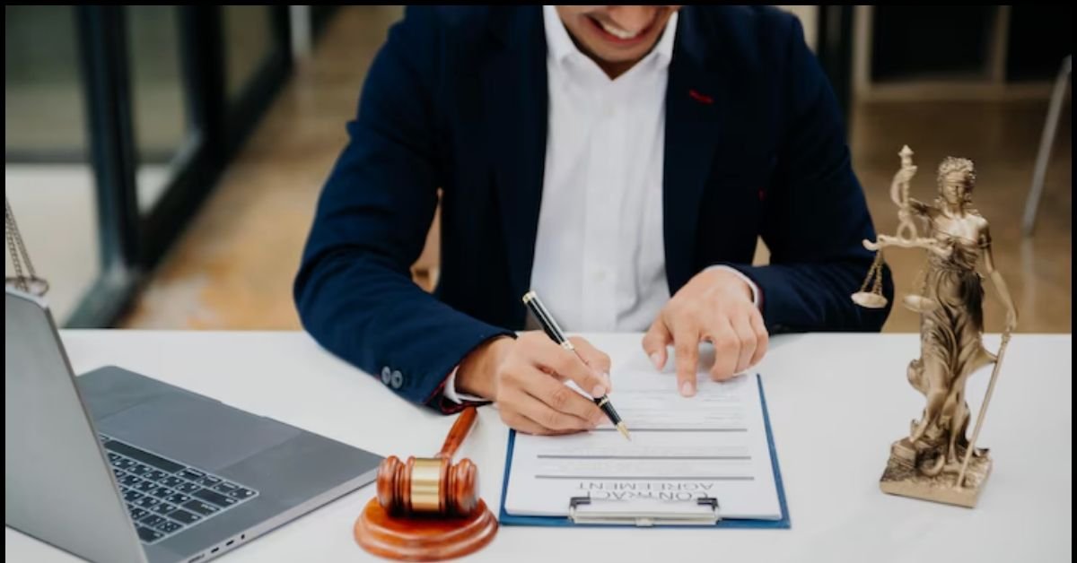 A professional notary public at a desk, stamping a document, with an ink pad and legal paperwork in view.